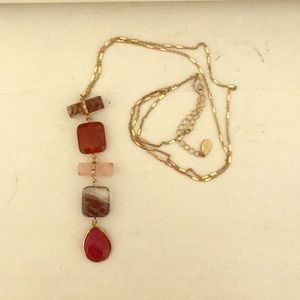 Red stone pendant necklace on gold chain